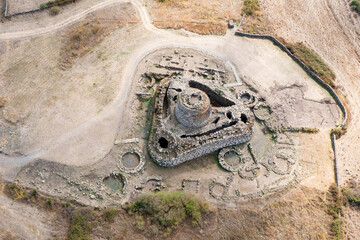 View from above, stunning aerial view of the ancient Santu Antine Nuraghe. Santu Antine Nuraghe is...