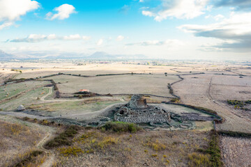 View from above, stunning aerial view of the ancient Santu Antine Nuraghe. Santu Antine Nuraghe is one of the largest Nuraghi in Sardinia, Italy.