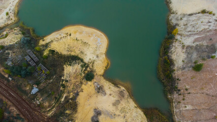 Aerial view of opencast mining quarry. Industrial place view from above. pollution of ecology