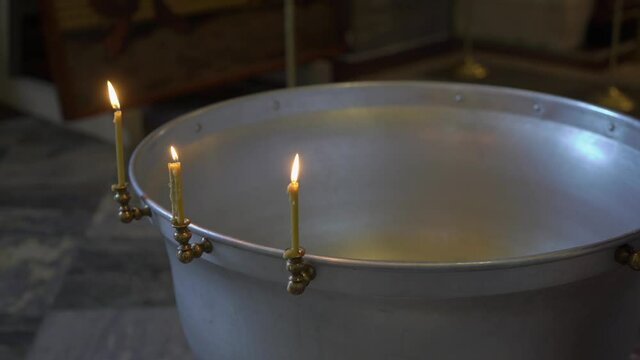 Church font for baptism. Christening ceremony. Interior of the temple.
