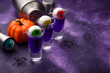Halloween purple cocktail with eyes.