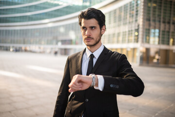 Businessman looking at his watch