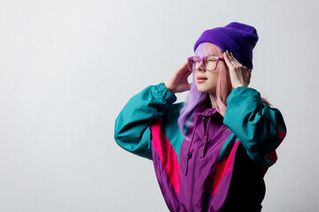 Beautiful woman in glasses and 80s sportsuit