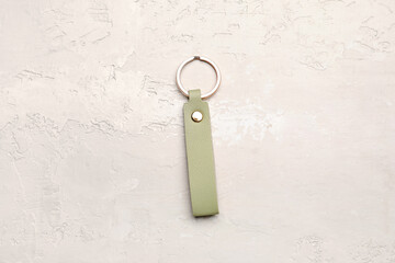 Leather keychain on light background