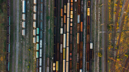 Aerial View. Old defective and looted railway wagons stand on the territory of the repair depot awaiting repairs. Poor business management. Ukrainian railway, DVRZ.