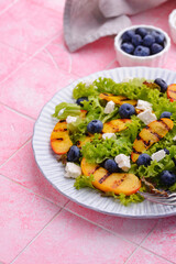 Salad with grilled peach, blueberry and feta