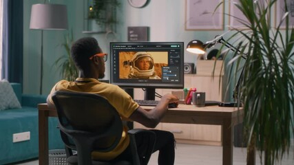 Black man using photo editing software