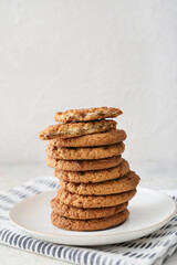 Plate with tasty hojicha cookies on white background