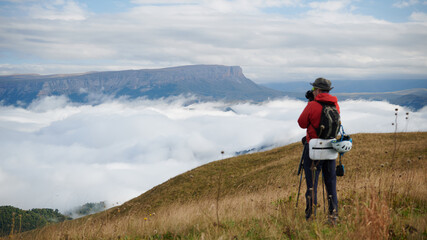 Fototapeta premium The photographer looks at the clouds