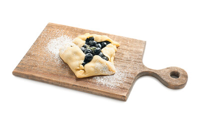Board with raw blueberry galette on white background