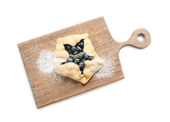 Board with raw blueberry galette on white background
