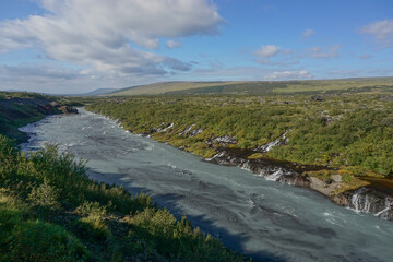 Borgarfjordur Region, Iceland: The Hraunfossar waterfalls, formed by rivulets streaming out of the Hallmundarhraun, a lava field formed by an eruption of a volcano under the glacier Langjokull.