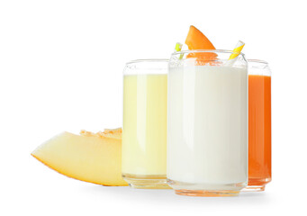 Glasses of tasty melon milkshake on white background