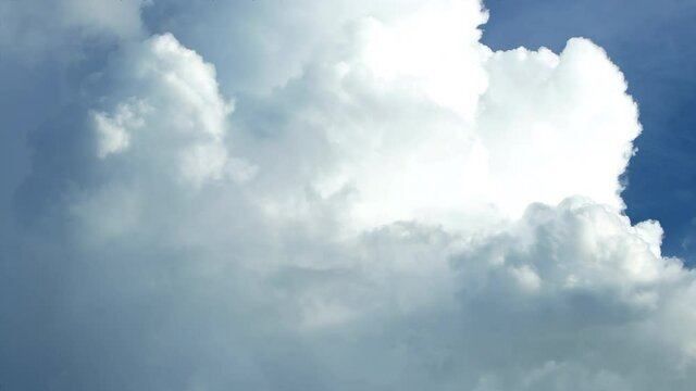 Stunning huge cumulus clouds swirl in the daytime. Timelapse, relaxation weather dramatic beauty atmosphere background