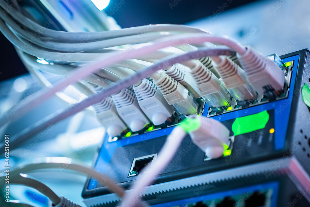 Poster network cables connected to hub. optic fiber cables connected to data center. cables in data center.