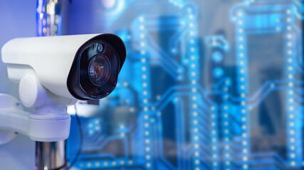 CCTV security ?amera. Video surveillance, security. A video camera on a blue background. White video camera closeup. The control system in the building. - obrazy, fototapety, plakaty