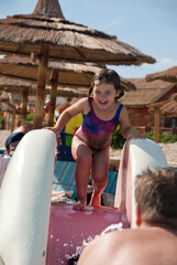 child playing in the pool