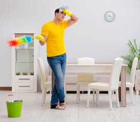 Man husband cleaning the house helping his wife