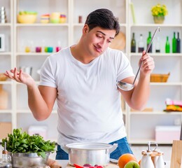 Young male cook working in the kitchen