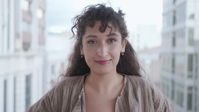 Close-up portrait of nice-looking multi-race brunette beautiful elegant young woman slow motion looking into camera. Daily people life, fashion, beauty. Female portraits.	Female portraits. 4k footage