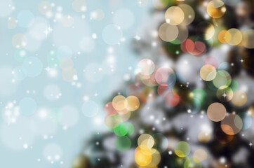 Obraz na płótnie Canvas Blurred background of colorful Christmas tree with bokeh and snowflakes. Space for text, copy-space.