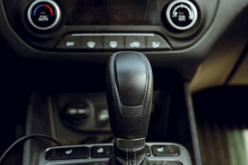 Fototapeta na wymiar gear shift knob of a used car. Close-up, selective focus.