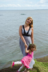 Fototapeta na wymiar mother and child on beach