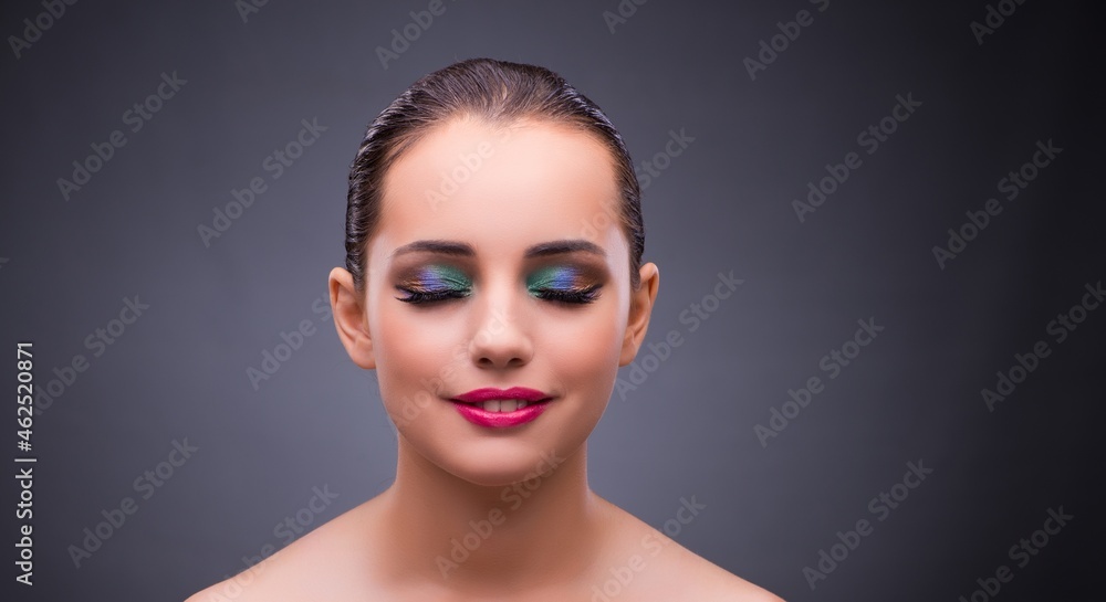 Wall mural Woman in beauty concept on gray background