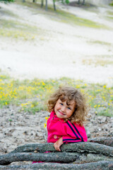 little child playing on the beach