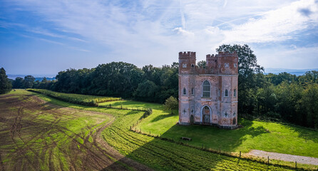 The Belvedere Tower over Powderham Park from a drone, Powderham Castle, Exeter, Devon, England - obrazy, fototapety, plakaty