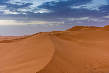 Fototapeta na wymiar Beautiful landscape of the dunes of the Sahara Desert at dusk, Merzouga, morocco