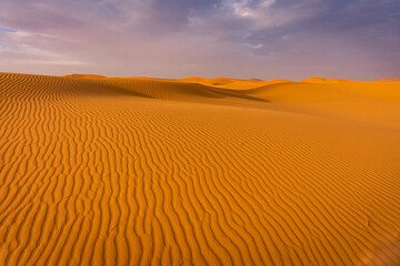 Fototapeta na wymiar Beautiful landscape of the dunes in the Sahara Desert, Merzouga, Morocco