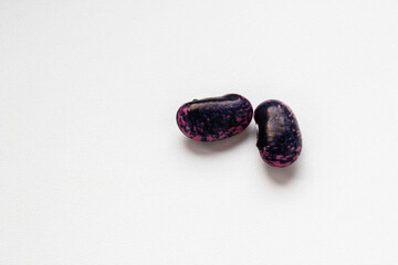 Mature seeds of decorative red beans. Taken in close-up. Space for text. 