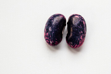 Mature seeds of decorative red beans. Taken in close-up. Space for text. 