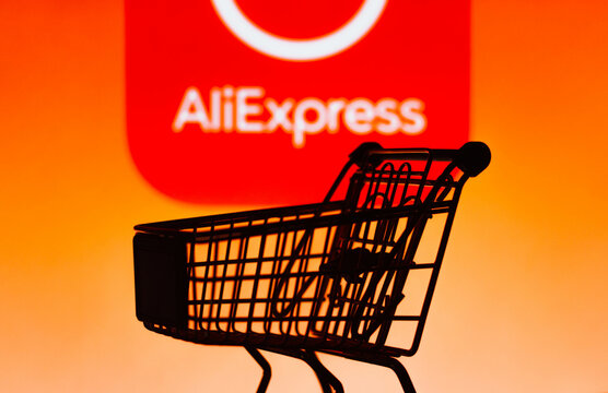 October 4, 2021, Brazil. In this photo illustration a shopping cart is seen in front of the AliExpress e-commerce company logo.