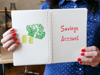 Financial concept meaning Savings Account with sign on the piece of paper.