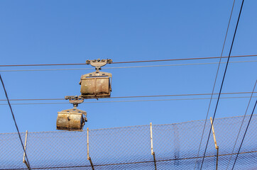Transportation of rock in trolleys by air.