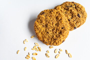 Top view of luscious low calories homemade oatmeal cookies on a white table. healthy lifestyle and energetic snack concept. 