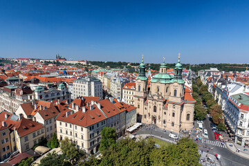 Obraz premium Landscape view of the old town square and the Saint Nicholas Church from the Astronomical Clock in Prague.
