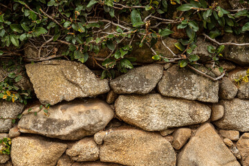 Ancient wall made of natural rocks