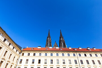 Obraz premium Royal Palace with the spires of St. Vitus Cathedral in the distance, Prague, Czechia.