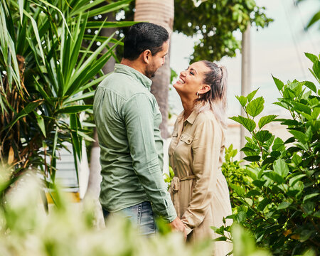 Young Latin Male And Female Couple Looking At Each Other In Love Between 25 And 35 Years Old