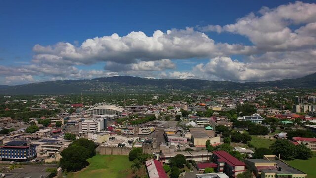 Aerial view of Kingston city, living houses, government buildings and mountains.