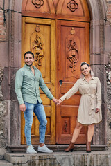 Fototapeta na wymiar Young latin male and female couple in love looking at the camera between 25 and 35 years old