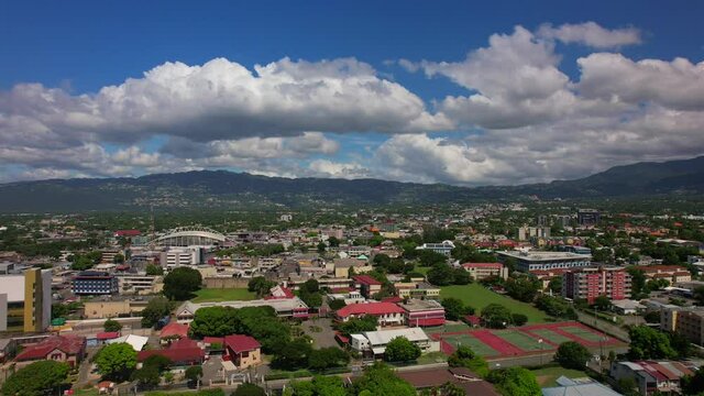 Aerial view of Kingston city, living houses, government buildings and mountains.