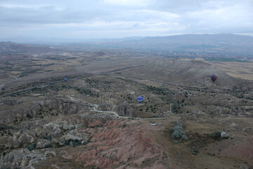 colorful hot air balloons on a foggy day, top view,