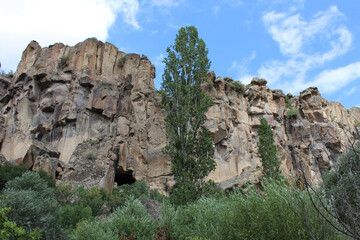 high gray rocks, aiming at the bright blue sky