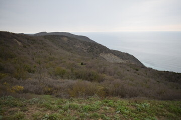 The outskirts of Anapa. Mountains and rocks, sunset. Black Sea on the horizon. Photo taken in spring.	