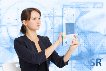 Business, Technology, Internet and network concept. Young businessman working on a virtual screen of the future and sees the inscription: CSR