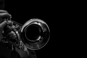 Abstract, musician playing the Trumpet black background